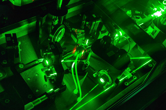 Detail shot of laser in laboratory_05 A detail shot of a laser in the lab in dark green colors.